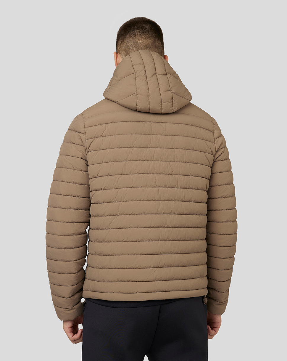 Back view of a beige mushroom hooded puffer jacket on a model with quilted panels