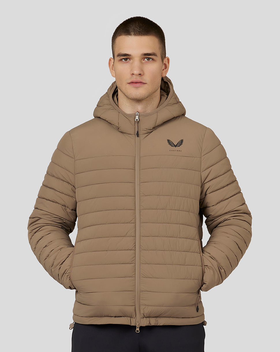 Man wearing mushroom colored hooded puffer jacket with zip front and left chest logo
