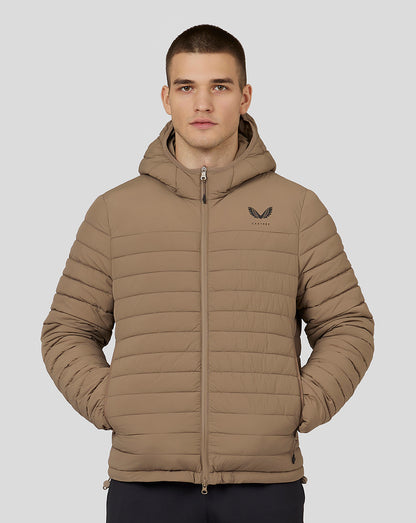 Man wearing mushroom colored hooded puffer jacket with zip front and left chest logo