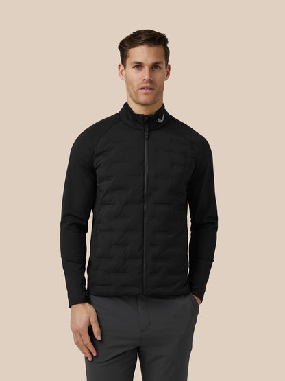 Male model wearing a black quilted Protek jacket with a stand collar and zip front.