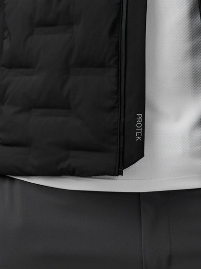 Close-up of black Protek golf jacket showing a vertical zipper and branding on the side panel.