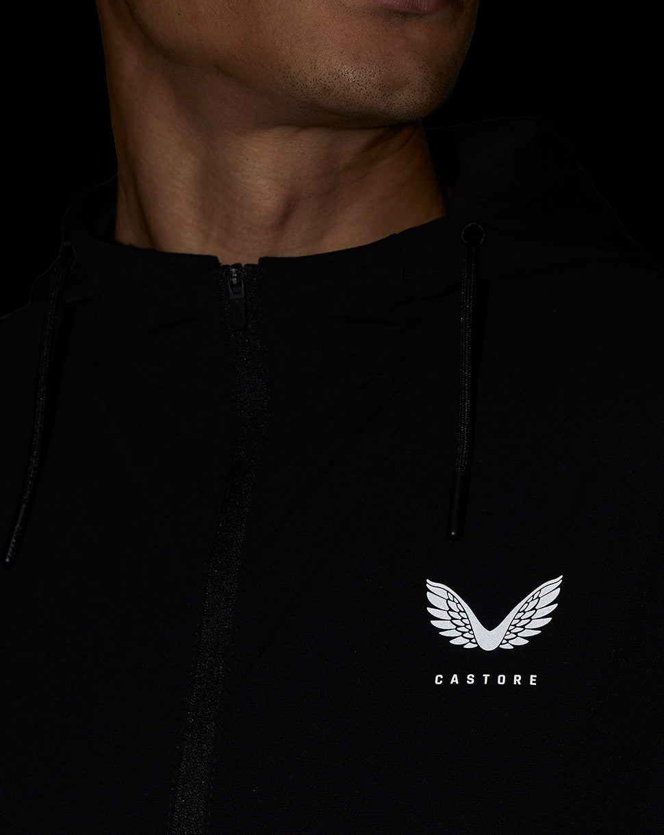 Close up of the jacket chest showing Castore logo and hood drawstrings