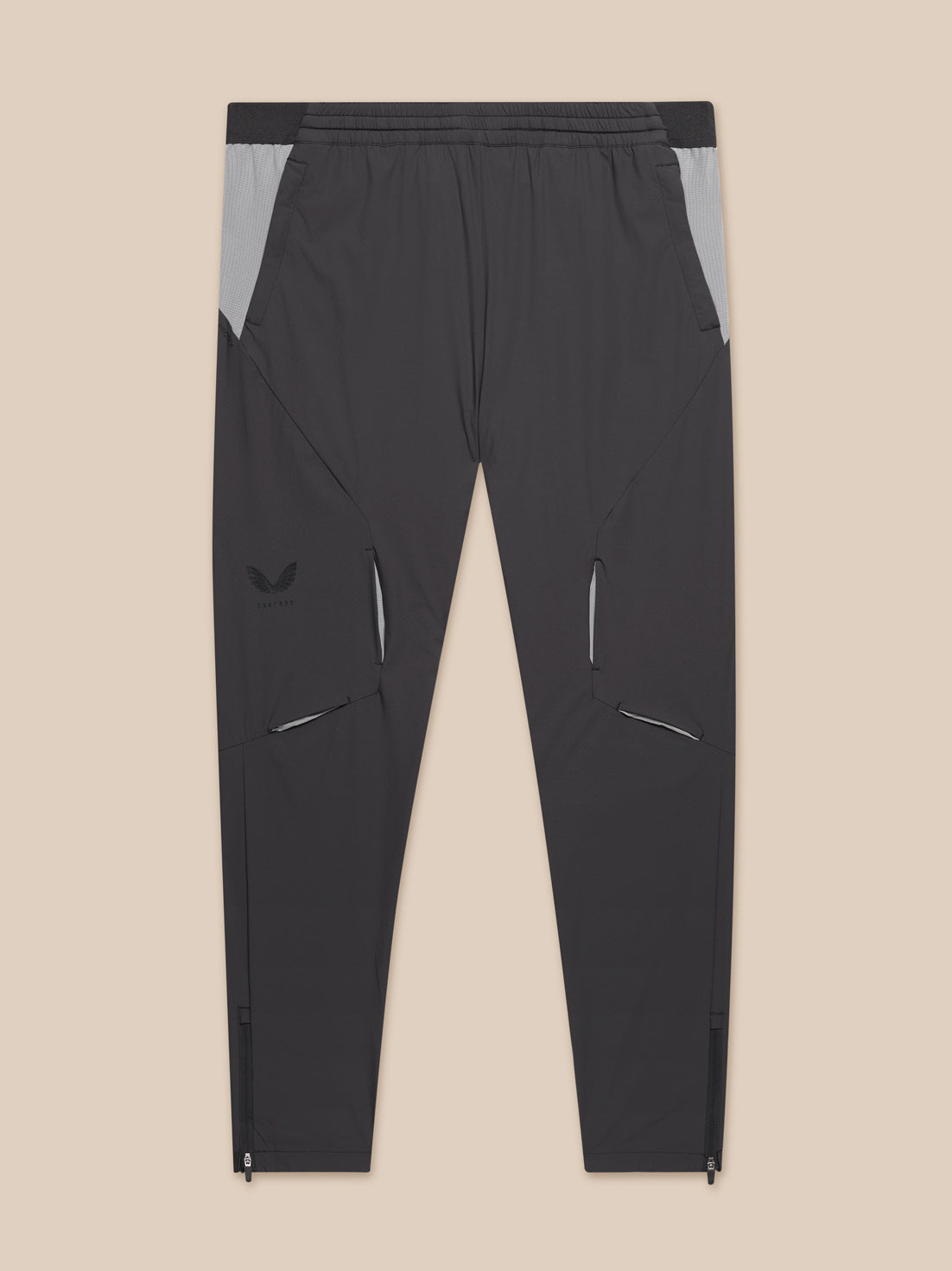Grey Flex Training joggers with panelled design zip cuffs and zipped pockets and Castore logo on left thigh