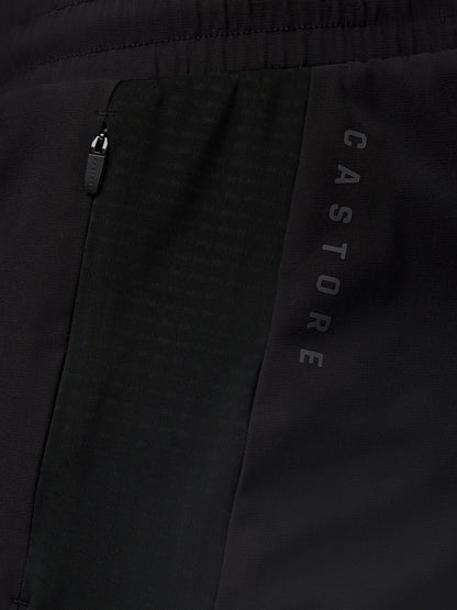 Close up of black Apex Training Shorts showing a side zip pocket and vertical Castore branding along the thigh