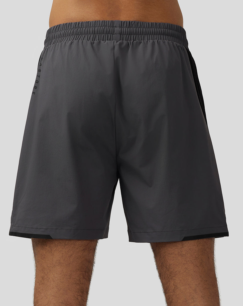 Back view of Apex Training Shorts gunmetal with a black side panel and subtle logo near the hem