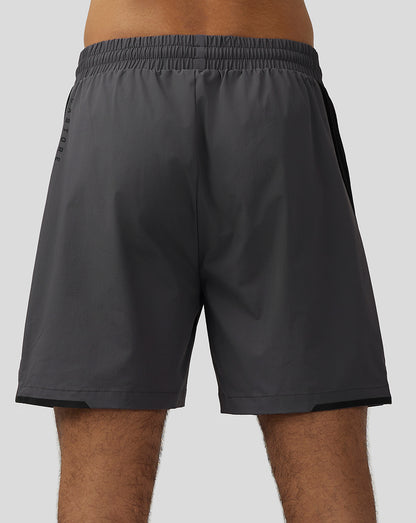 Back view of Apex Training Shorts gunmetal with a black side panel and subtle logo near the hem