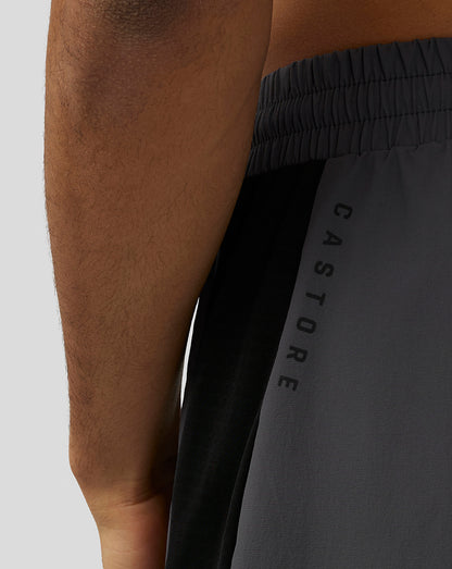 Close-up of the rear waistband area of the gunmetal Apex Shorts with Protek branding and a black side panel