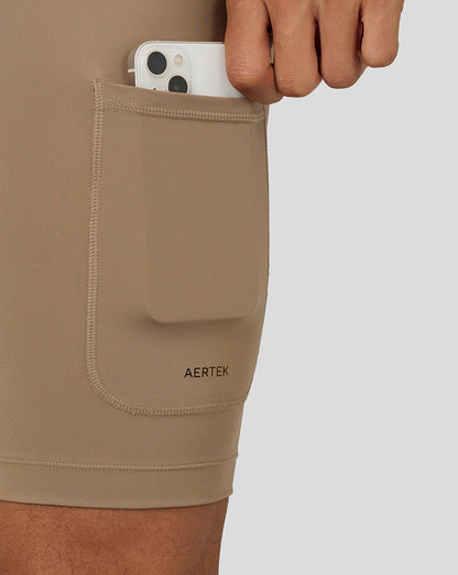 Side pocket detail on Flow Training Shorts with a phone tucked in