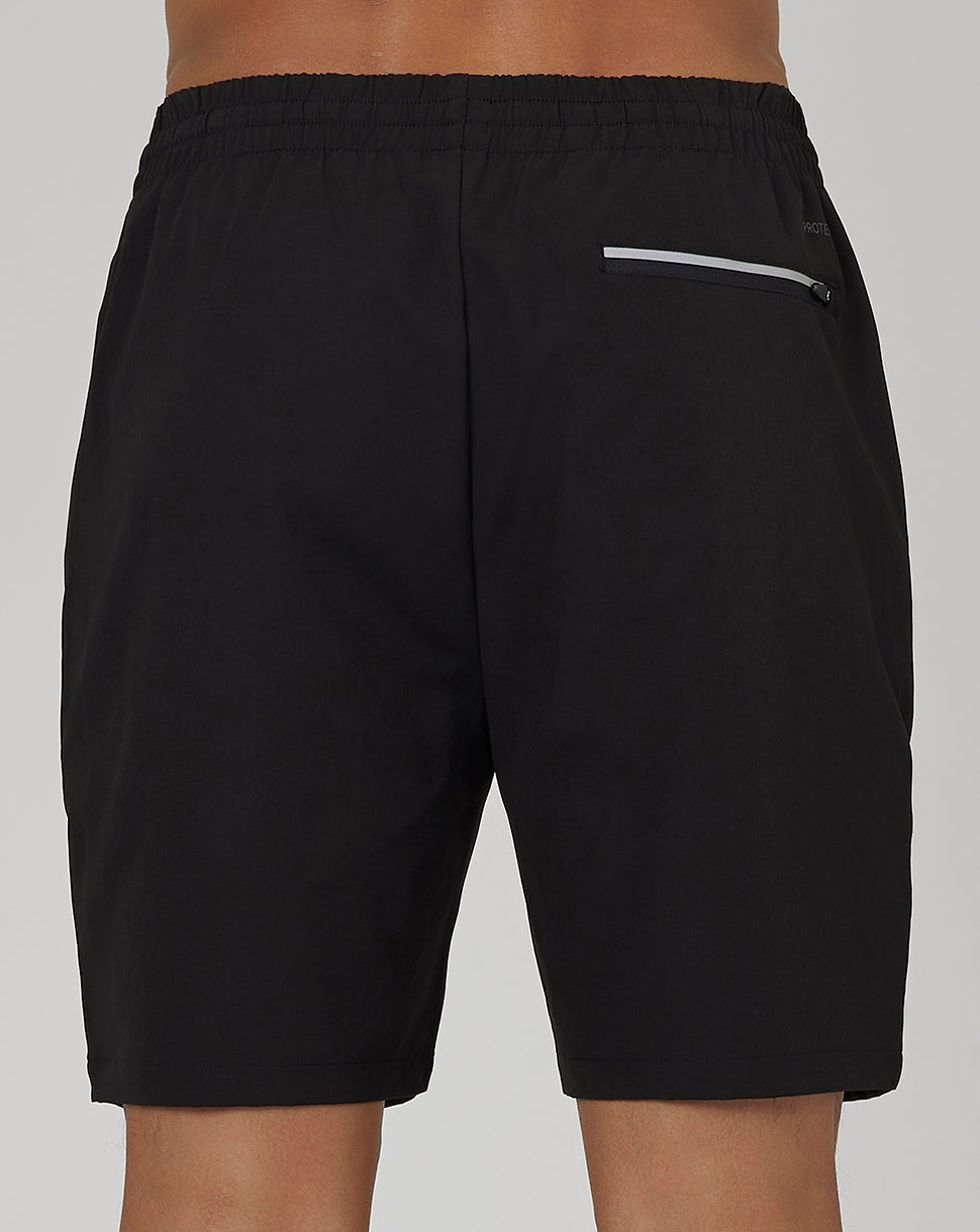 Back view of black Men’s Flex Woven Cargo Shorts with elastic waistband and discreet zip pocket.