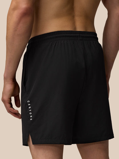 Back view of black Adapt Training shorts with vertical Castore branding along the left leg