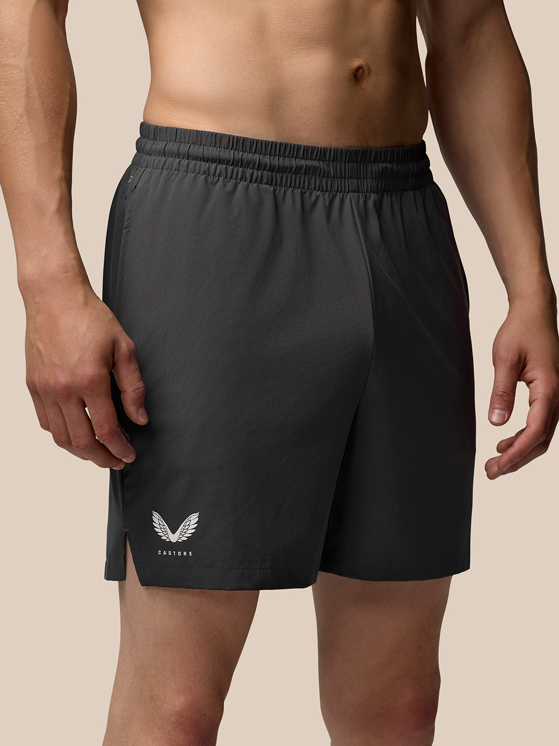 Grey Adapt Training 7 inch shorts back view featuring elastic waistband and Castore logo on the left leg.