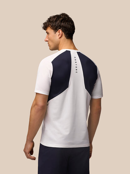 Male model wearing Apex Training T-Shirt white and navy back view showing Aeromesh back panel and Castore branding