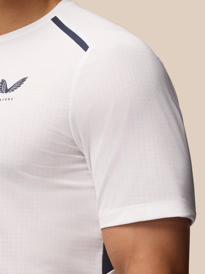Close-up of white Apex Training T Shirt with navy shoulder stripe and Castore logo on chest.