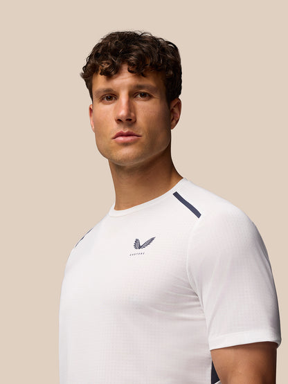 Back view of Apex Training T-Shirt white and navy with vertical CASTORE branding along the spine and Aeromesh branding at left back