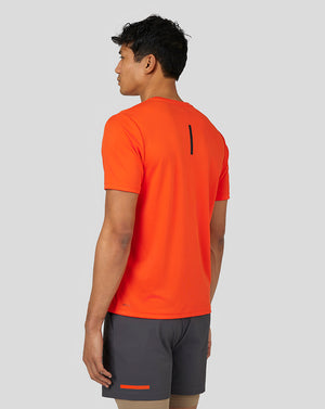 Back view of Deep Orange Flow Short Sleeve Graphic T Shirt featuring a vertical black stripe on the upper back.
