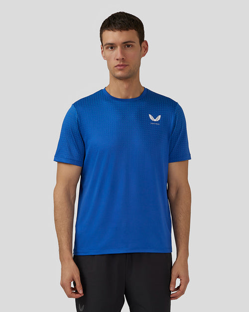 Front view of royal blue Flow Short Sleeve Knit T-Shirt with crew neck and small Castore logo on the chest.