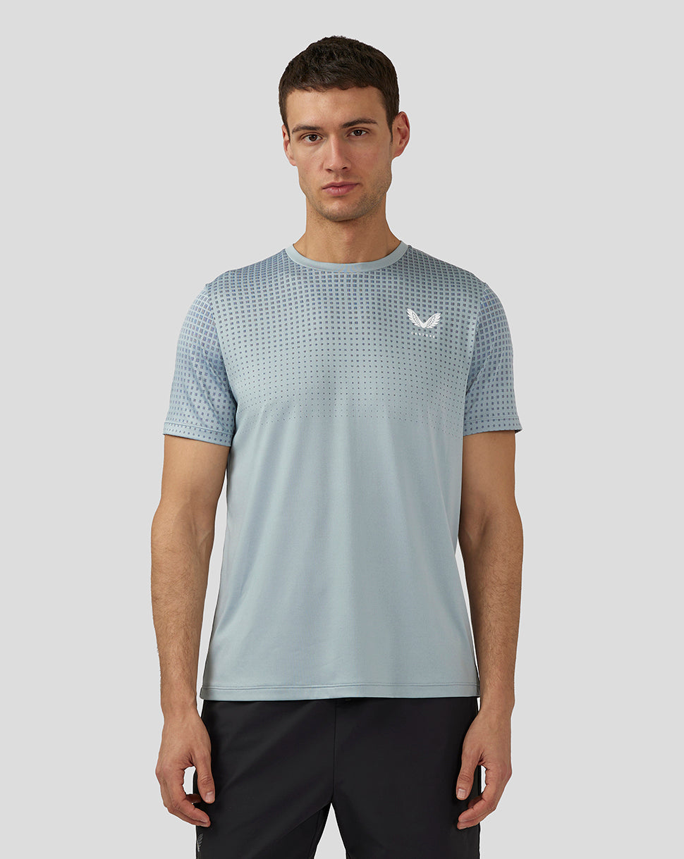 Front view of stone blue training T shirt with dotted upper chest pattern and Castore logo on chest.