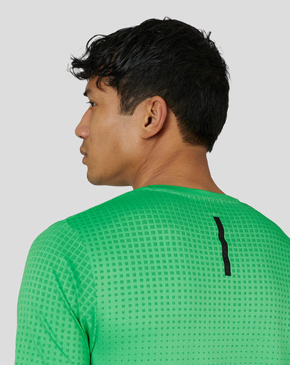 Profile view of male model wearing lime gradient jacquard knit T-shirt with back seam detail