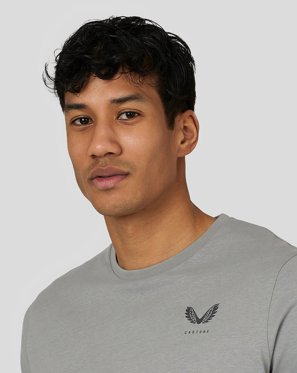 Male model wearing steel grey Castore Men’s Flex Short Sleeve T Shirt with left chest logo