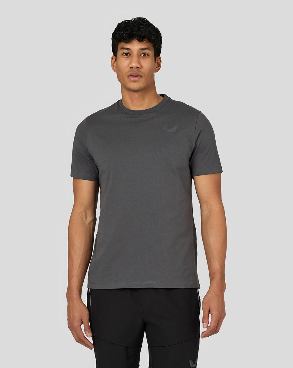 Front view of a male model wearing a gunmetal gray Castore Men’s Flex Short Sleeve T Shirt with a crew neck