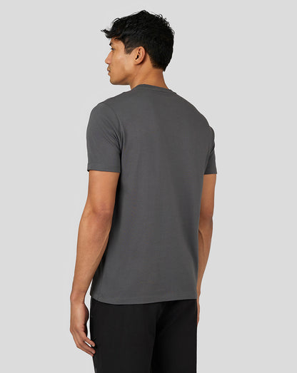 Back view of a male model wearing the gunmetal gray Castore Flex Short Sleeve T Shirt