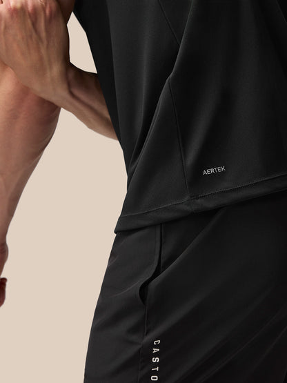 Close up of black Adapt T shirt fabric with AERTEK branding at the back hem.