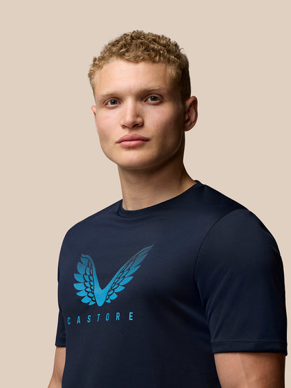Male model wearing Adapt Training T-Shirt in midnight navy with Castore wings graphic on chest