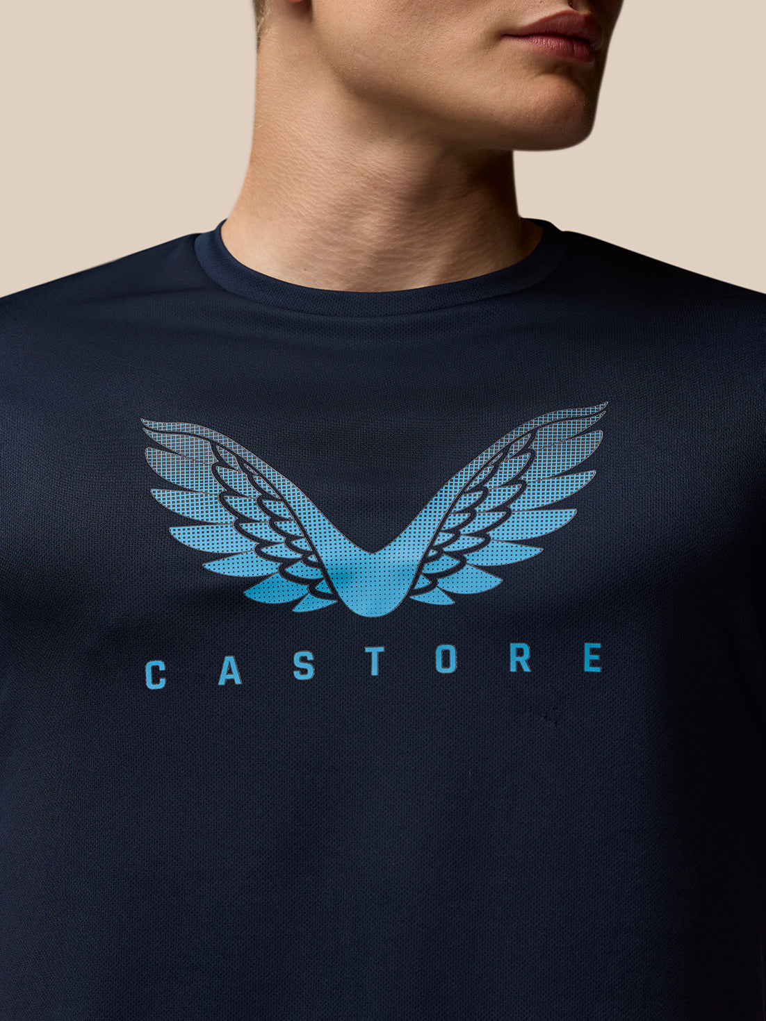Navy Adapt Short Sleeve Graphic T-Shirt with blue Castore wings logo on chest