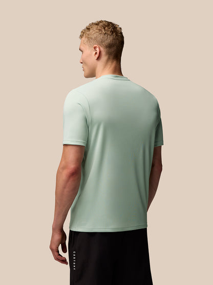 Back view of mint green Adapt Training T Shirt with AerTek branding at the lower back