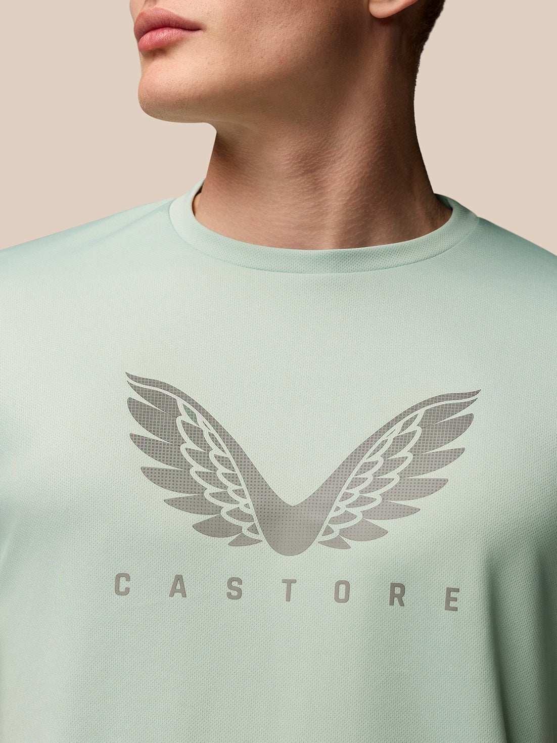 Front view of mint green Adapt Training T Shirt with Castore wings graphic on the chest