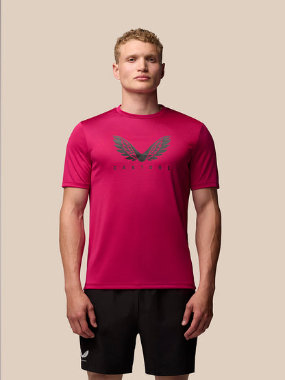 Front view of pink Adapt Training T-Shirt on a model, featuring a crew neck, short sleeves, and Castore wings graphic on the chest.