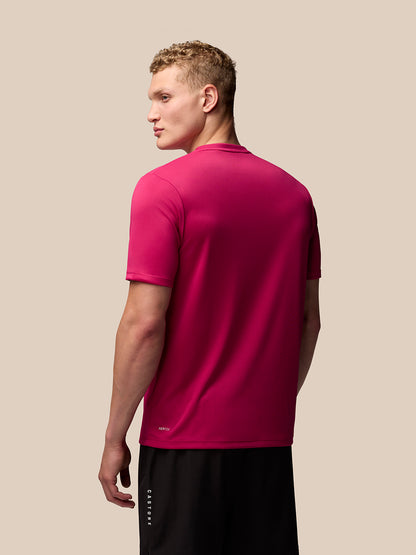 Back view of pink Adapt Training T-Shirt on a model, highlighting regular fit and smooth fabric.