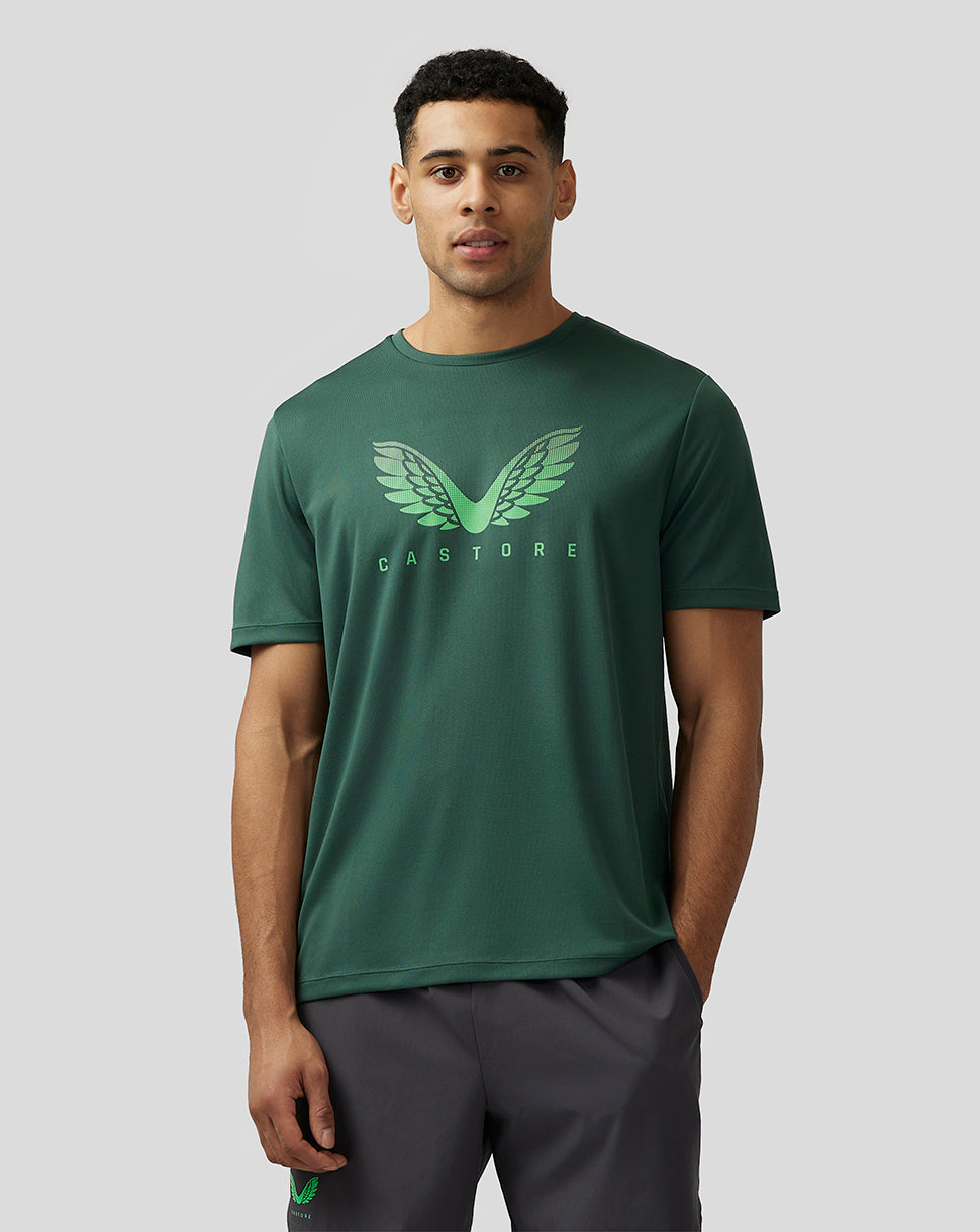 Male model wearing green Adapt Training T Shirt with Castore wings graphic on chest.