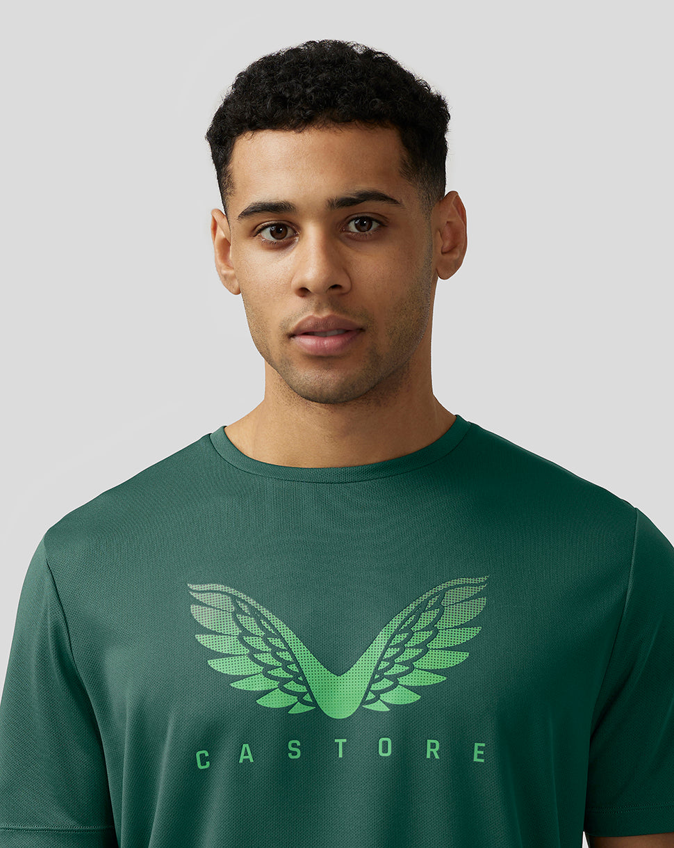 Close up of man in green Adapt Training T Shirt with wing logo on chest