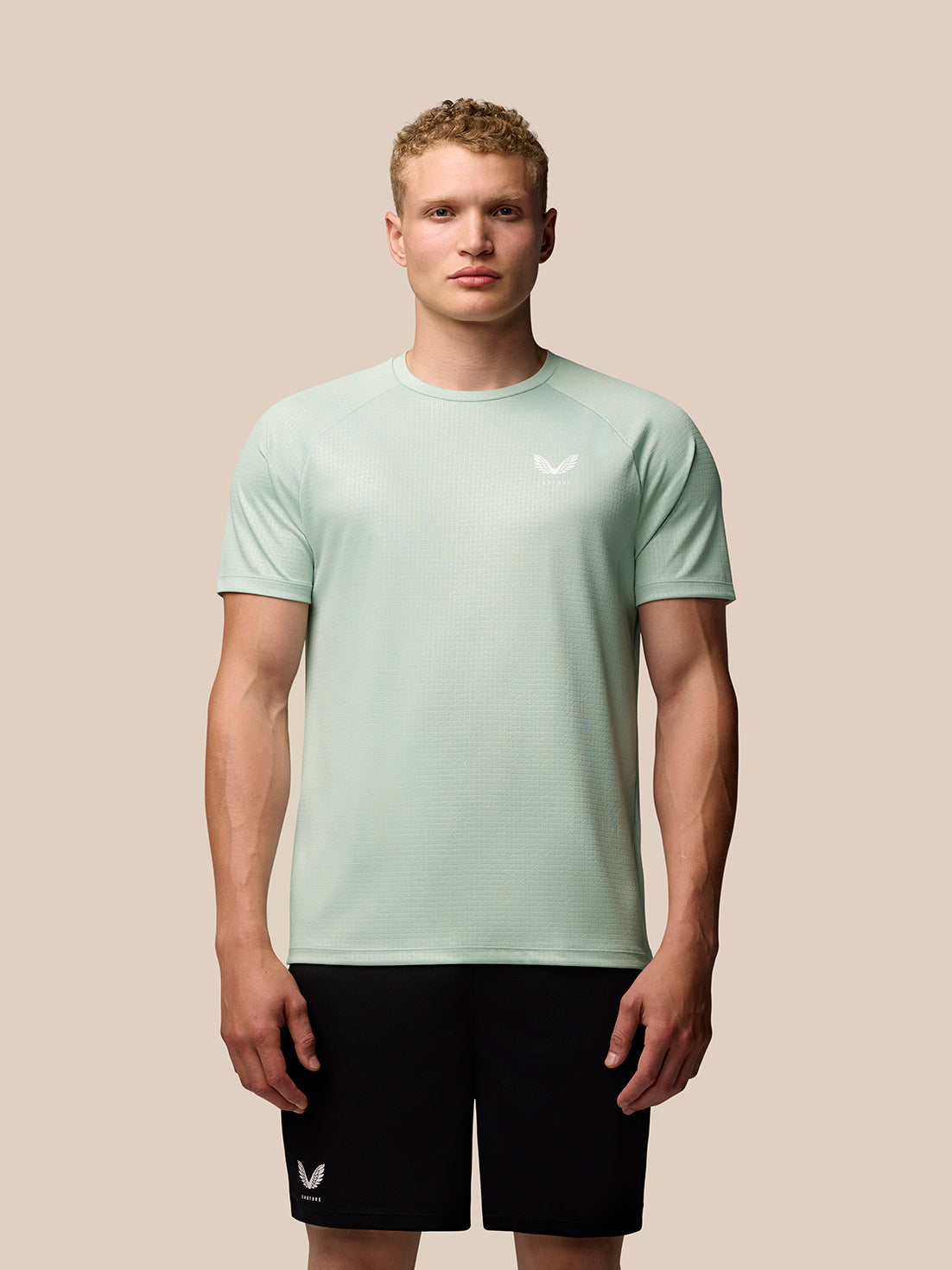 Mint green Adapt Training T Shirt with geometric pattern and Castore branding on chest