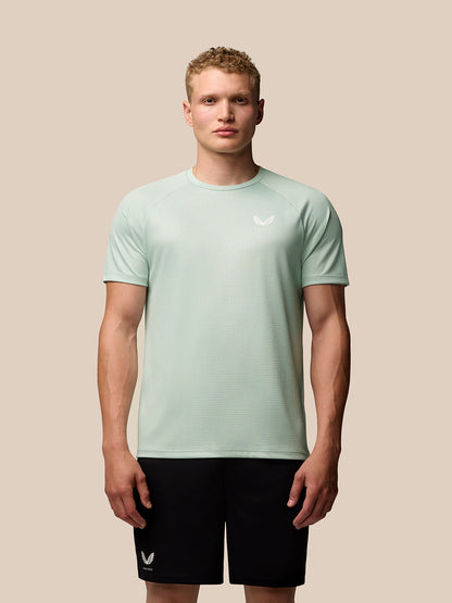 Mint green Adapt Training T Shirt with geometric pattern and Castore branding on chest