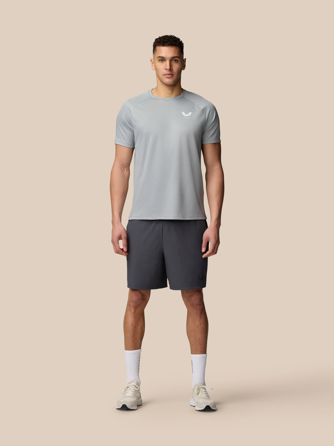 Male model wearing Adapt Training T-Shirt in Mid Grey with Castore logo on the chest and upper back