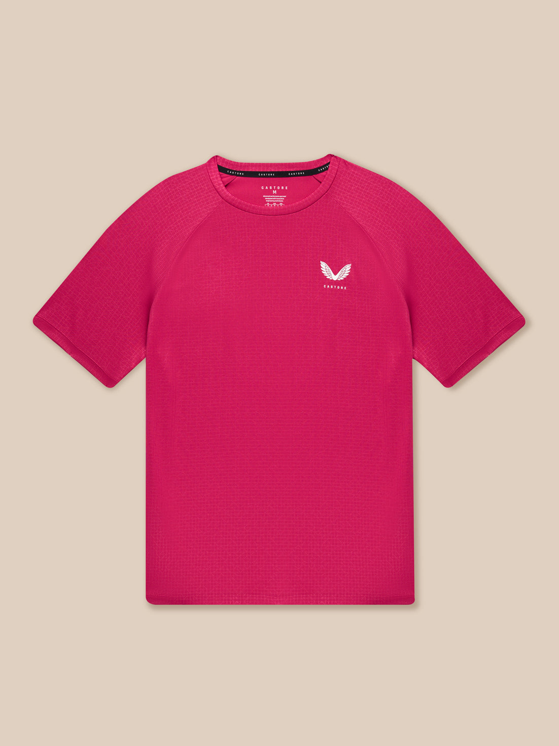 Close up of pink Adapt Training T Shirt showing all over geometric pattern and Castore branding on chest.