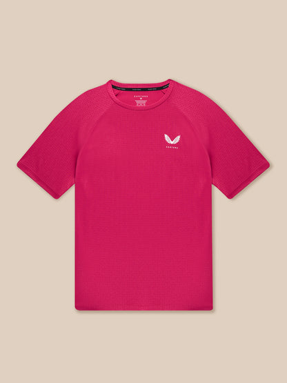 Close up of pink Adapt Training T Shirt showing all over geometric pattern and Castore branding on chest.