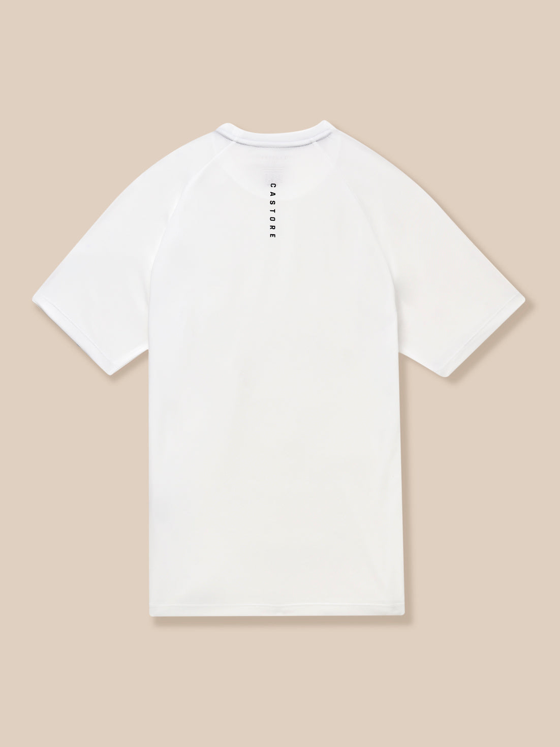 Model wearing white Adapt Training T-Shirt showing Castore logo on the chest and a vertical Castore label at the back of the neck