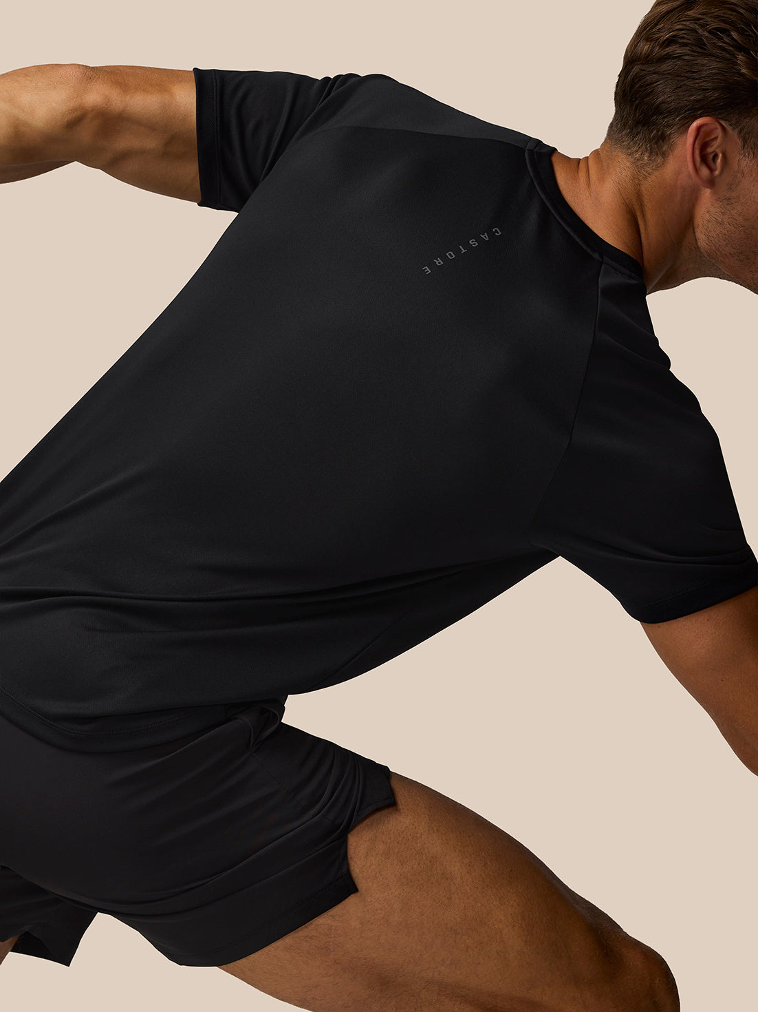 Side view of black Adapt Training T Shirt with Castore branding on the chest area