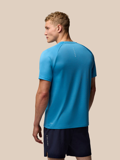 Back view of blue Adapt Training T-Shirt showing Castore branding along the upper back.