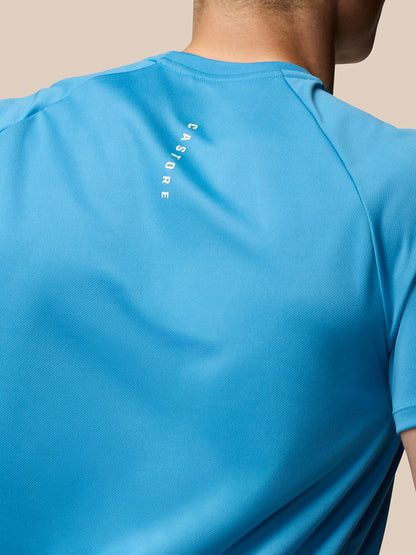 Back view of corn blue Adapt Training T-Shirt with vertical Castore branding along the back.