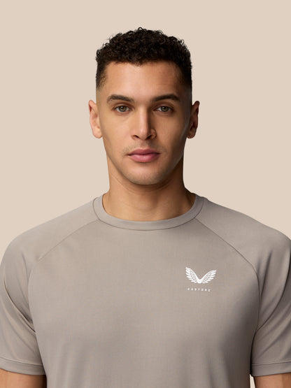 Close-up of left chest on light grey Adapt Training T-Shirt showing the Castore logo