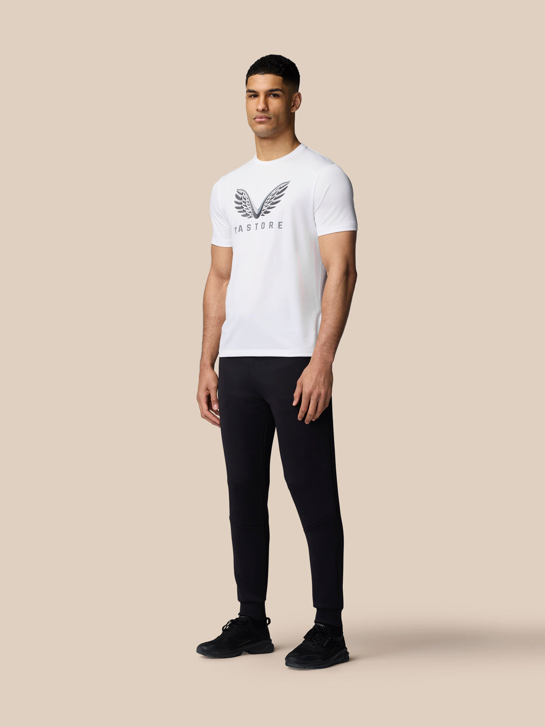 Front angled view of white graphic T shirt with Castore wings logo on chest