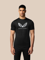 Man wearing black short sleeve graphic training T-shirt with white Castore wings on the chest.