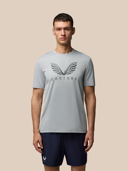 Male model wearing grey Adapt Graphic Training T-Shirt with Castore wings logo on the chest.