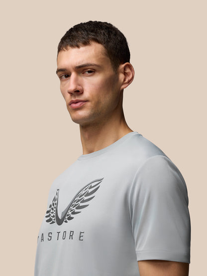 Male model wearing Adapt Graphic Training T-Shirt in grey white with Castore wings logo on chest