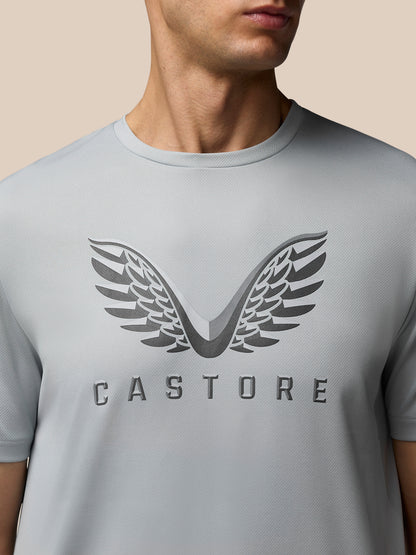 Close up of the grey Adapt Graphic Training T-Shirt chest showing the large wing logo and CASTORE lettering.