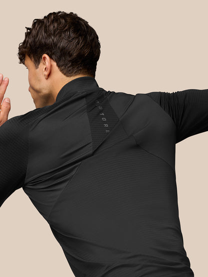 Back view of black Apex Training top showing Aeromesh branding along the back panel.